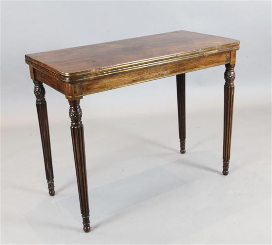 A Regency brass strung rosewood card table, W.3ft 1.5in. D.1ft 6.5in. H.2ft 5in.